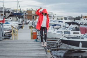 young woman in red cloak enjoying Blaine Harbor