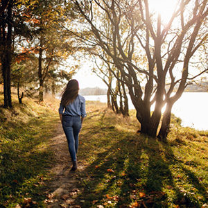 Young woman walking by the ocean in blaine