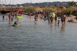 Swimmers gathered at Semiahmoo Spit swimming area in Blaine, Washington
