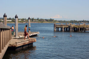 Swimmers jumping off dock at Semiahmoo