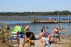 Swimmers gather around the beach in Blaine