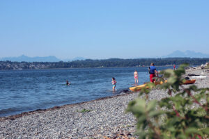 Kayakers prepare to paddle on the beach next to Semiahmoo Spit in Blaine